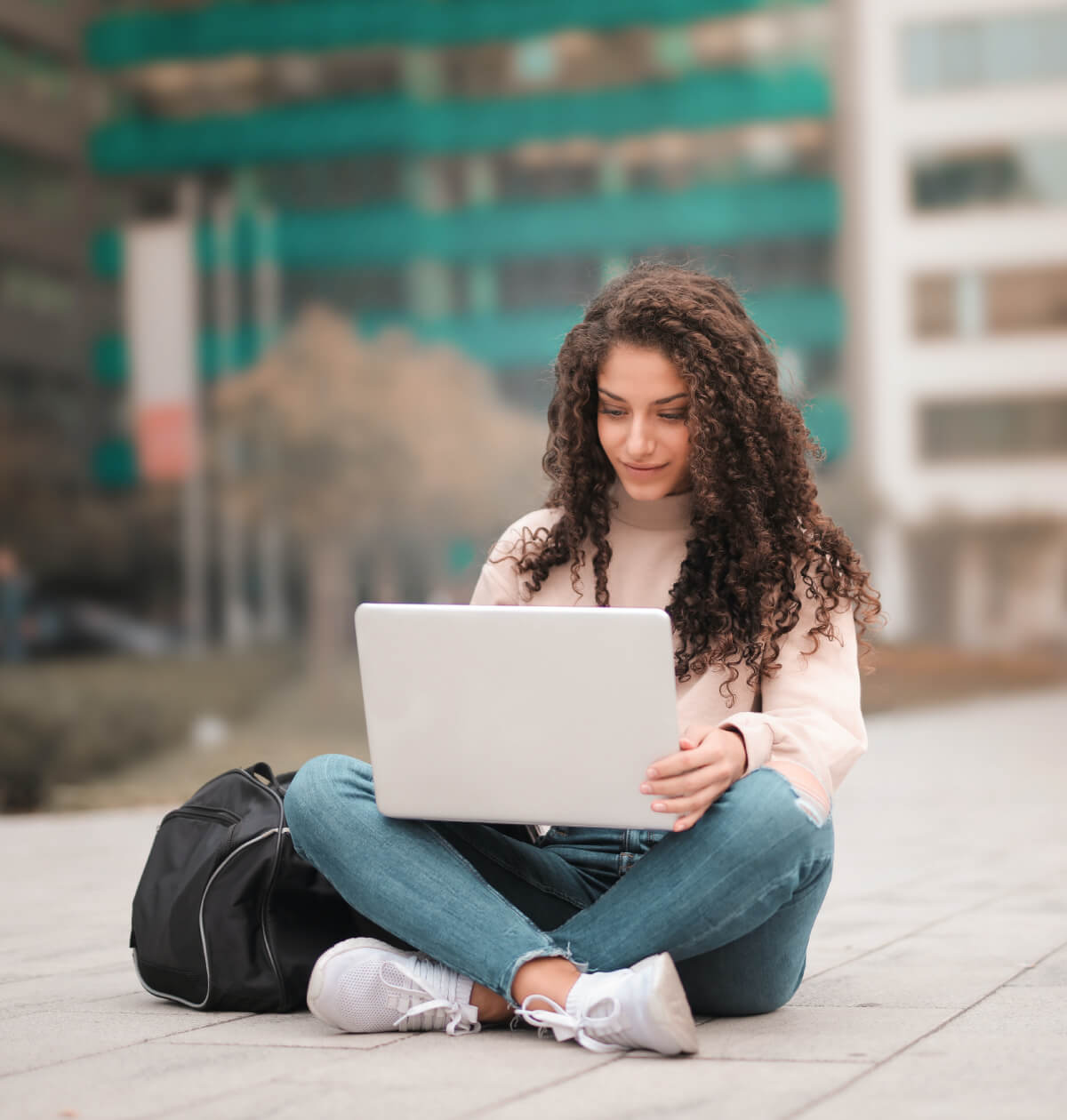 Student on her laptop outside